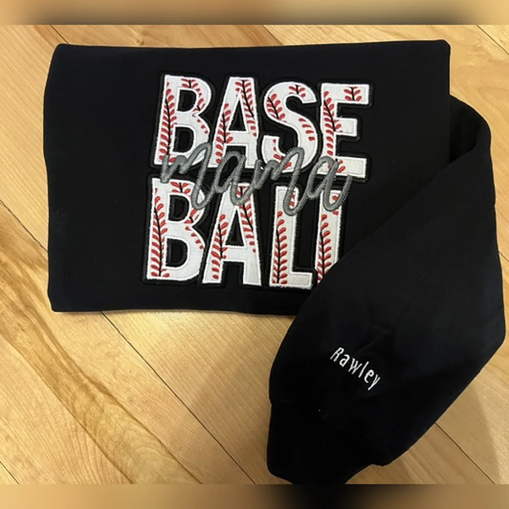 Black sweatshirt with BASE BALL stacked in baseball-stitch letters, mama in script across it, and Rawley on the sleeve.
