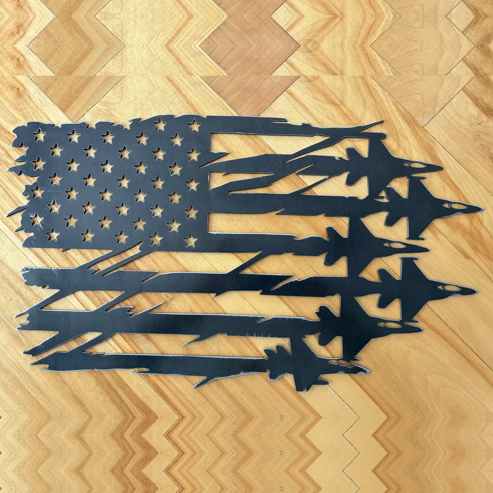 Black steel American flag with fighter jets flying out of the stripes.